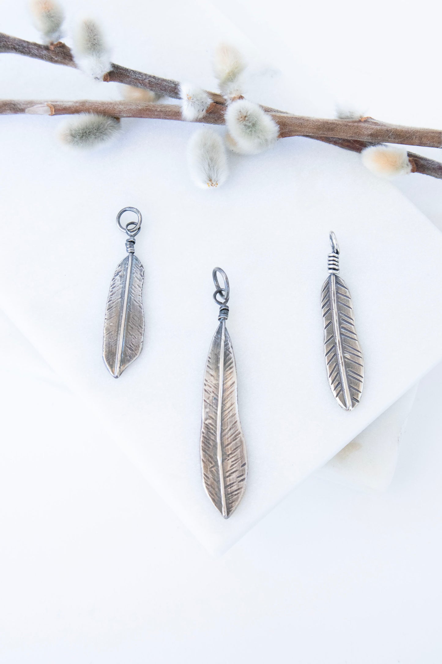 Forged Feather Charms